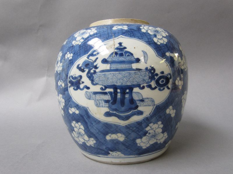 Chinese porcelain blue & white ginger jar with still life panels to a prunus & cracked ice ground