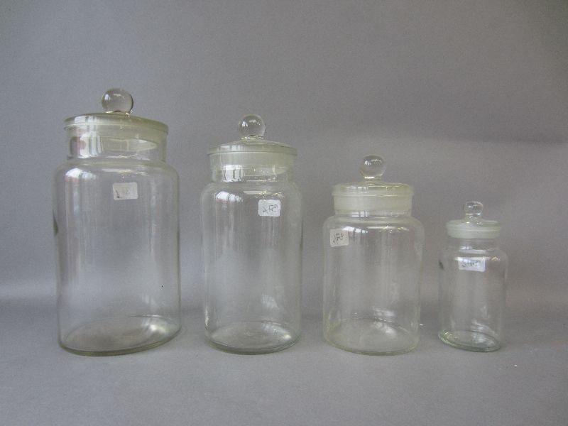 Set of four graduated glass storage jars 28.5H & smaller