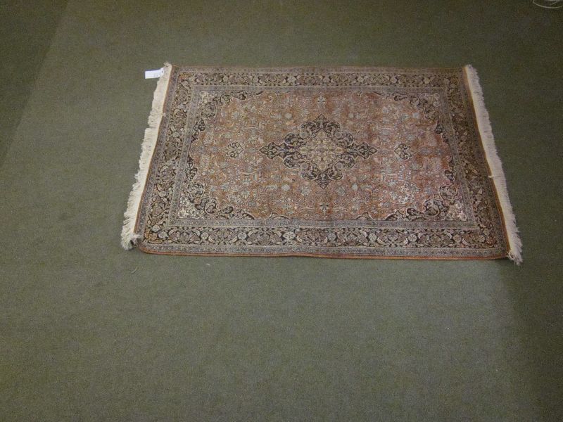 Orange ground silk Persian carpet with stylised  192x125 Arabesque within a black ground multi