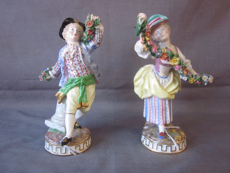 Pair of late C19th Meisson figures modelled as a young lady & gentleman with garlands of flowers