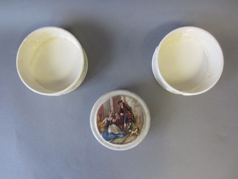 Pair of Royal Worcester creamware bottle coasters plus patum peperium pot (3)