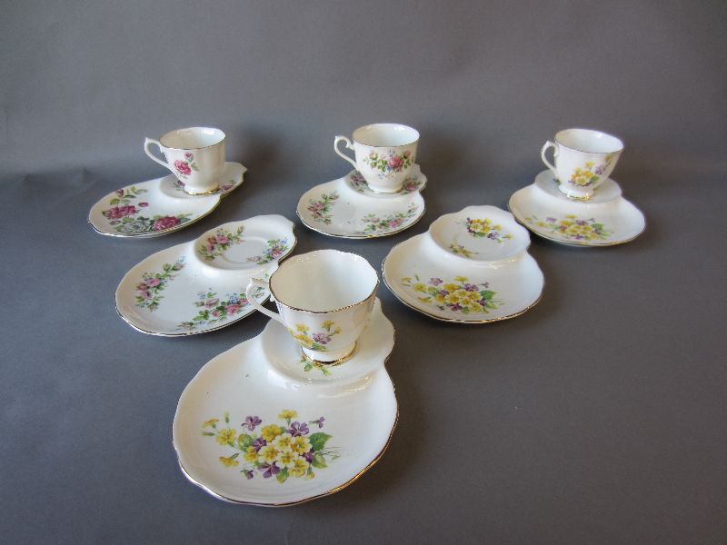 Collection of six Royal Albert sandwich cup & saucer sets with floral decoration (one broken)