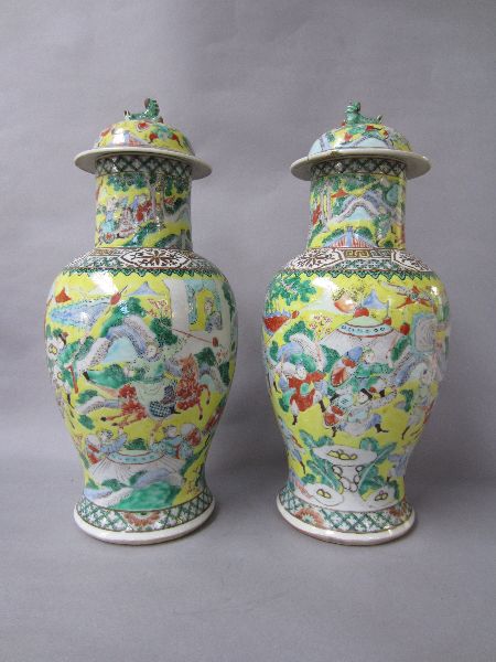 Pair of 1920`s famille verte yellow ground vases depicting scenes of war 46h