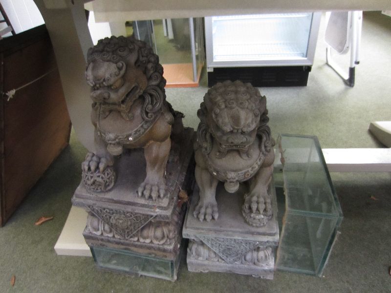Pair of grey cast Chinese dogs of fo on glass plinths 55h