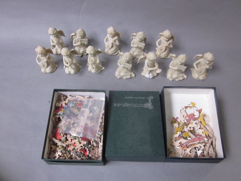 Three `Puzzleplex` jigsaws plus a collection of Christmas decorations & resin cast angels etc