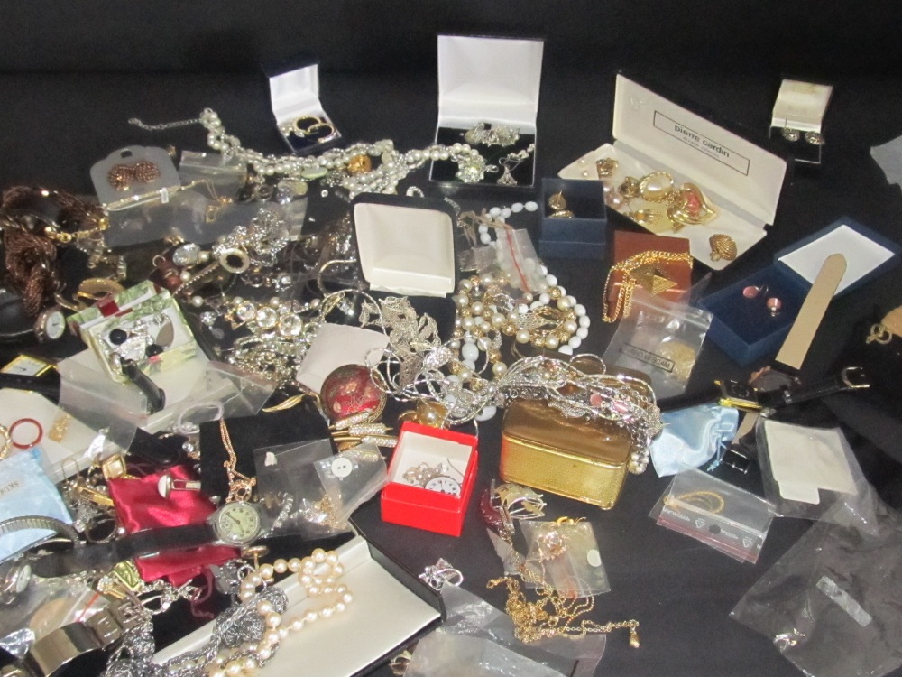 A large collection of costume jewellery to include watches, pendants, earrings, necklaces etc.