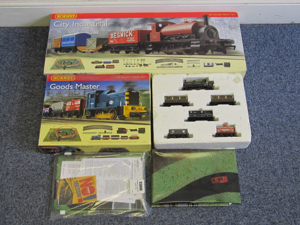 A boxed Hornby `City Industrial` OO gauge set, Hornby `Goods Master` set and one other set lacking