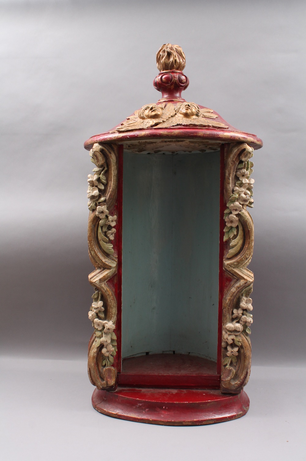A polychrome painted and carved wooden niche or grotto, approx 92cm high.