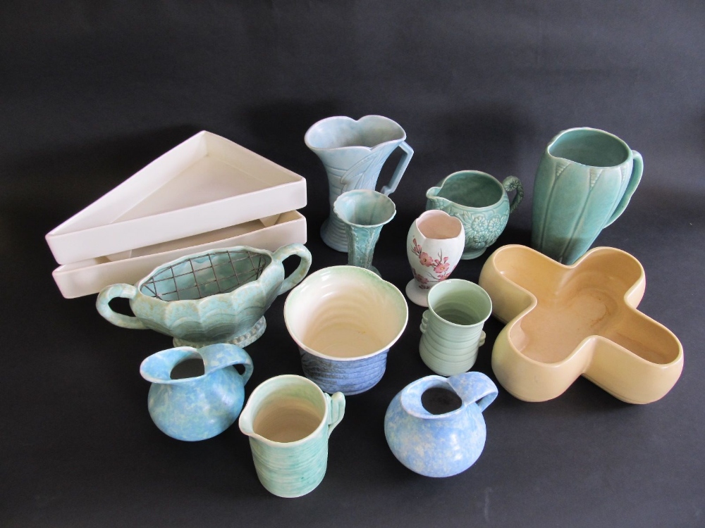 A collection of assorted vases, jugs and flower troughs.