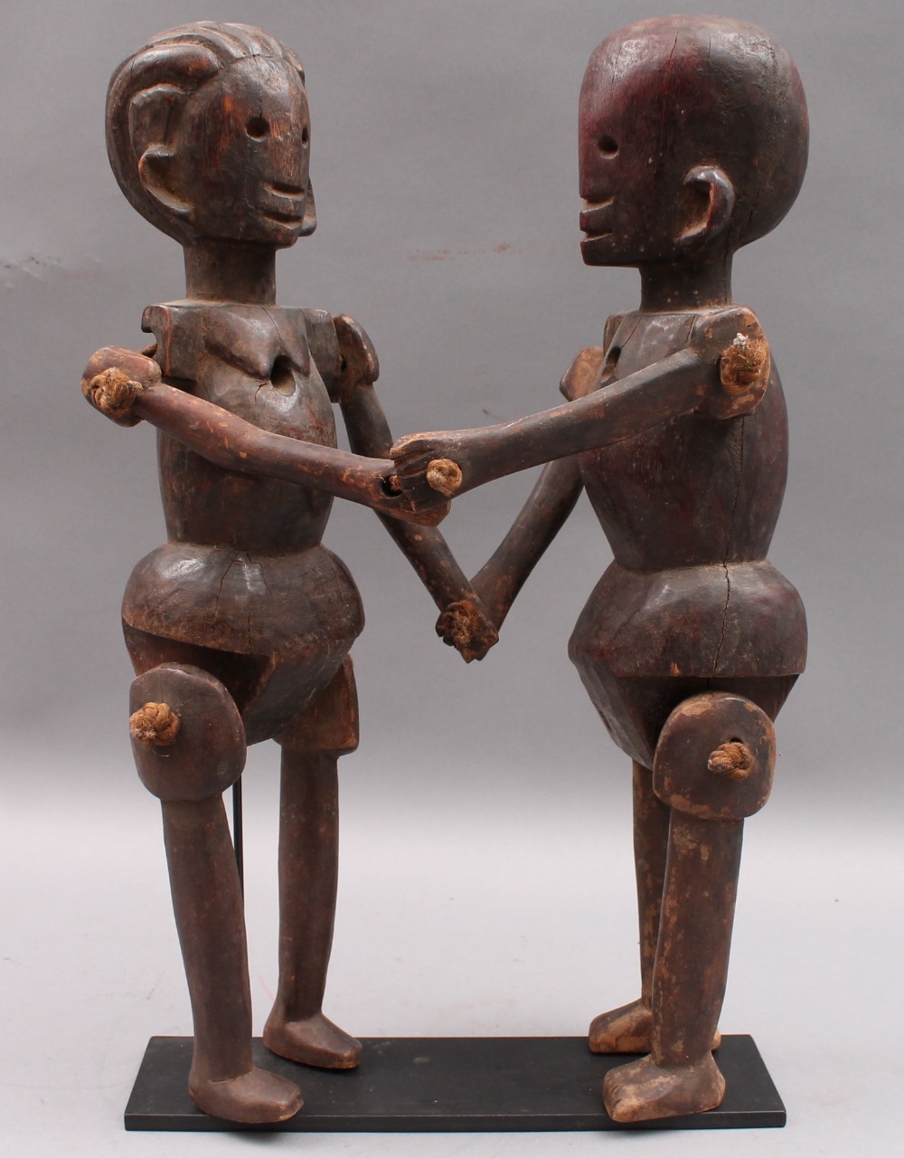 A pair of mounted Makonde puppet figures, approx 36cms tall.