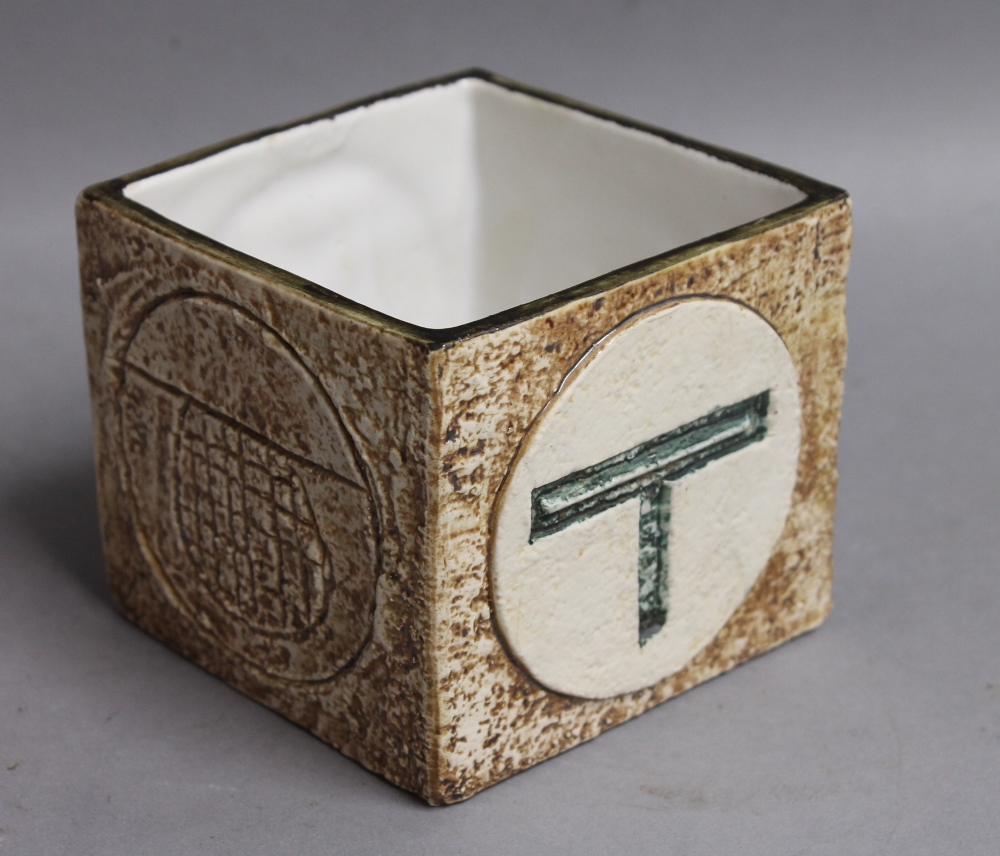 A small square Troika vase, marked to base `Troika Cornwall` and artists monogram `SK` for Simone