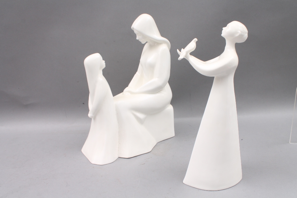 Two Royal Doulton white glazed figures: `Peace` HN2470 21cm high, and `Mother and Daughter` HN2841