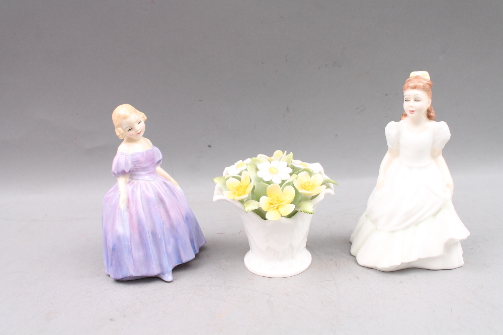 Two Royal Doulton figures `Kerry` and `Marie` plus a daffodil posy.