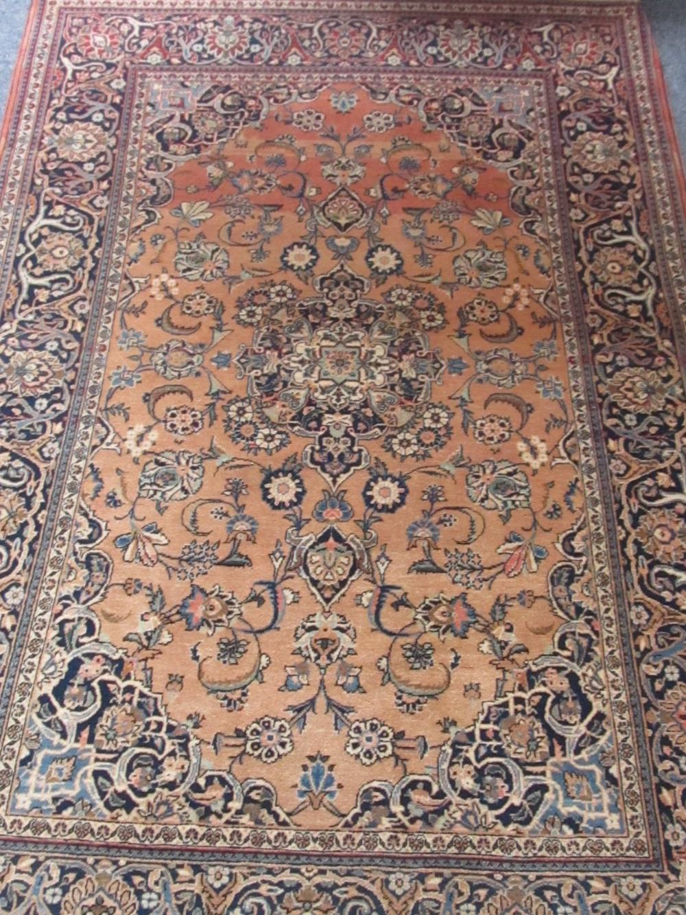 An ivory ground Kashan type rug, central field with foliate decoration (faded), 130cm x 206cm.