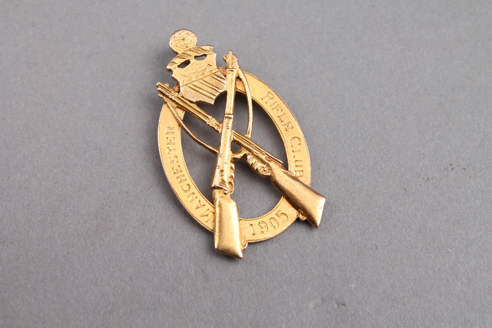 A 15ct gold Manchester rifle club pendant, approximately 6 grams gross.