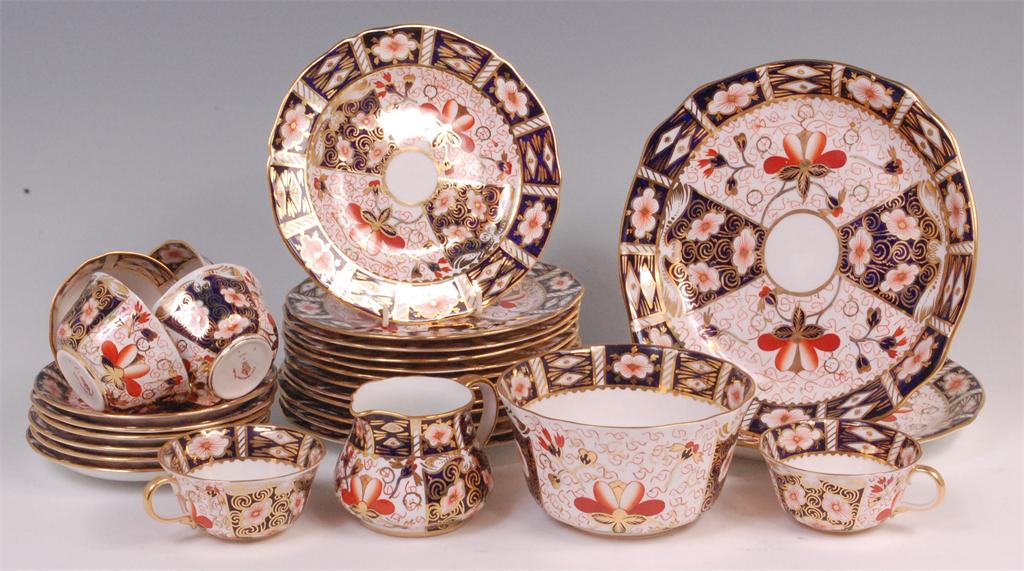 A Royal Crown Derby twelve place setting teaset, decorated in the Imari palette, pattern No.2451,