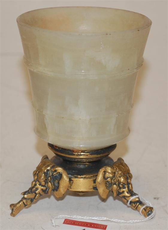A gilt metal and onyx footed vase