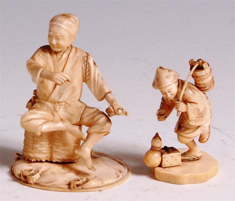 A Japanese Meiji period carved ivory Okimono of a street vendor, in seated pose upon a basket and on