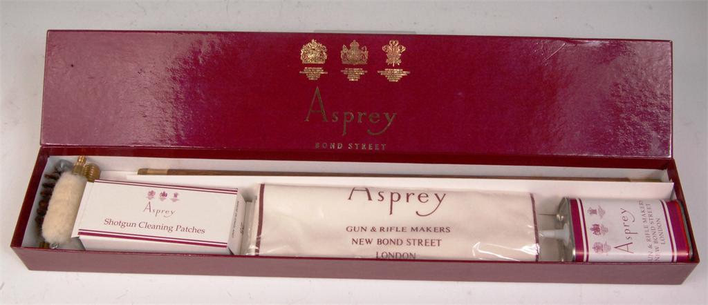 A boxed Asprey's shotgun cleaning kit, to include; rod with heads, patches, oil and cloth,