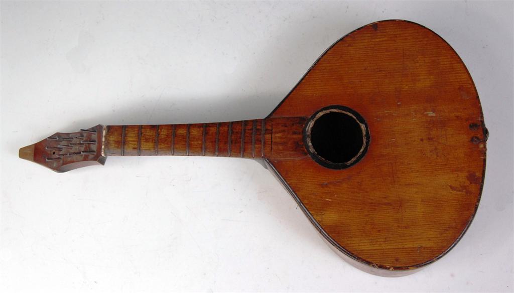 A late 18th century 12-string cittern, having pine front, lozenge inlays, and eleven frets (requires