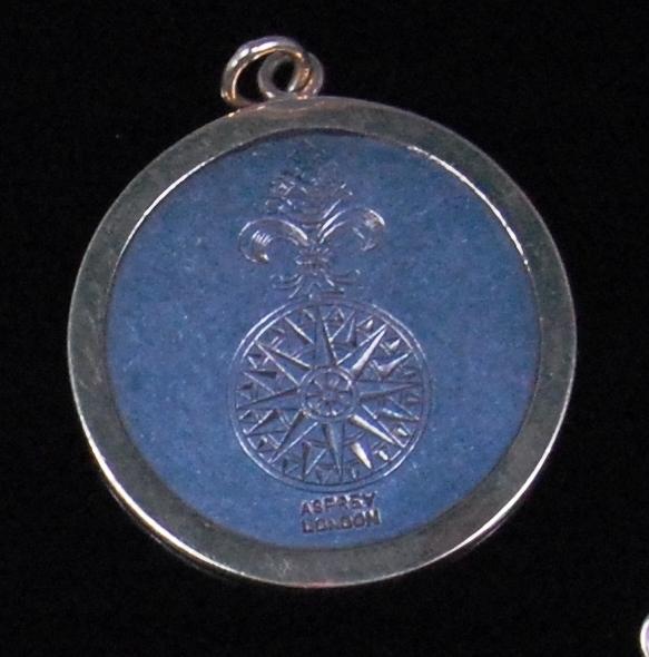 A modern silver and gold pendant by Asprey's of London, the reverse inscribed 'The Benedicts A A