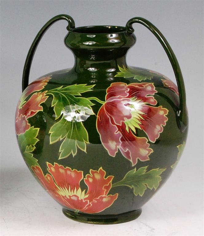 An Austrian Art Nouveau glazed ceramic twin handled vase by Julius Dresler, of bulbous form and