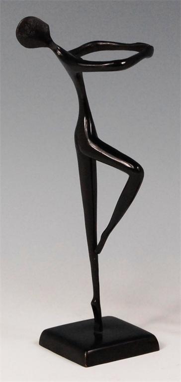 After Hagenauer - stylised bronze figure of a female nude ballet dancer, raised on integral square