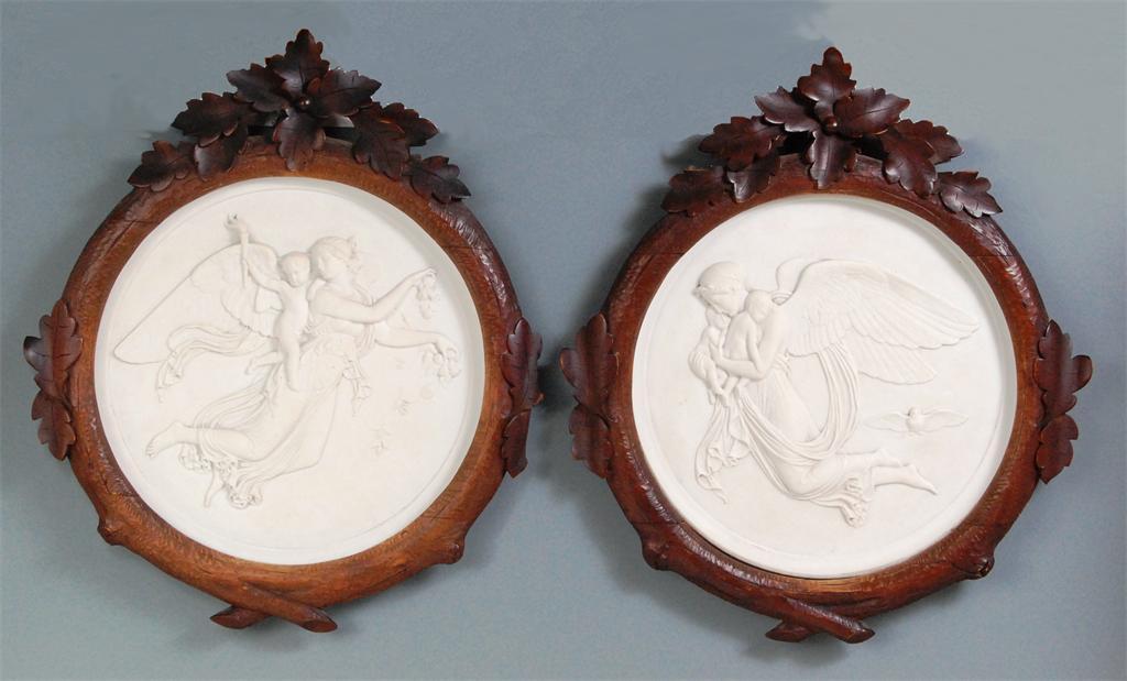 A pair of Royal Copenhagen porcelain plaques 'Day' and 'Night', each of circular form with first