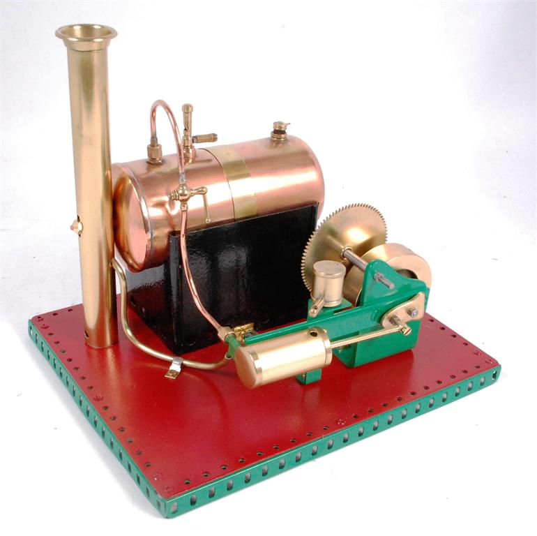 A scratch built spirit fired stationary steam plant, with a simple cased oscillating cylinder, fed