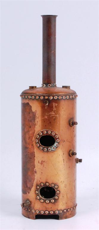 A part built copper vertical boiler with chimney, 12 inches overall, rivet detail and tappings for