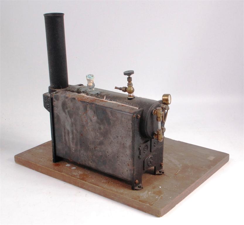 Stuart, stationary boiler No. 501, on wooden base with room to mount on engine, safety valve heavily
