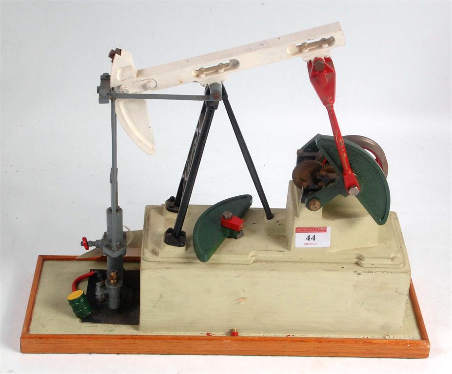 Stuart, oil field pump (nodding donkey), 15 inches x 4½ x 12 inches tall on wood base, mechanism has