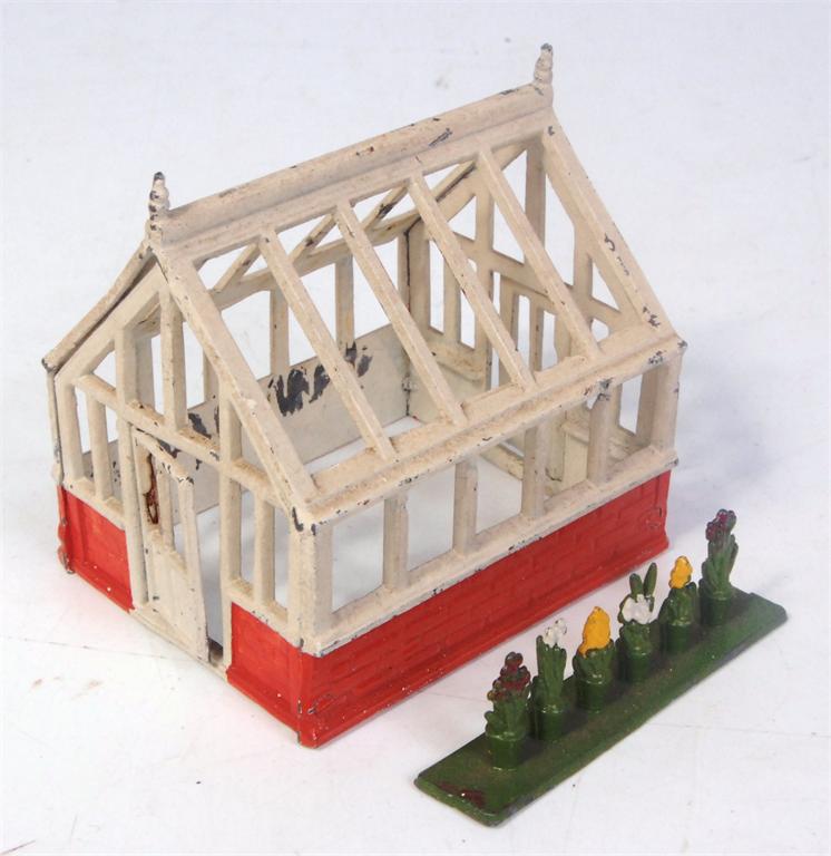 Cherilea lead miniature greenhouse, in orange and white, sold with 1 lead plant pot/floral group,