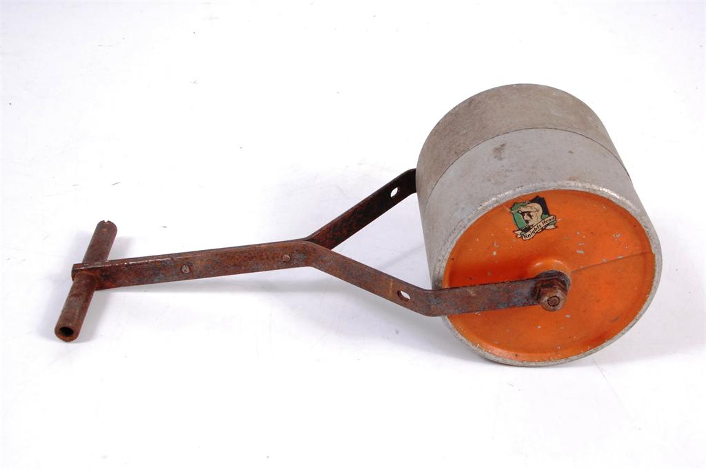 Knights Head stamped garden roller made of aluminium, finished with orange rollers, rust damage to