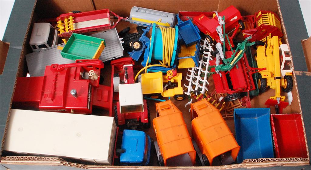 Approx. 25 Britains unboxed farm vehicles, components and accessories to include; Massey combine,