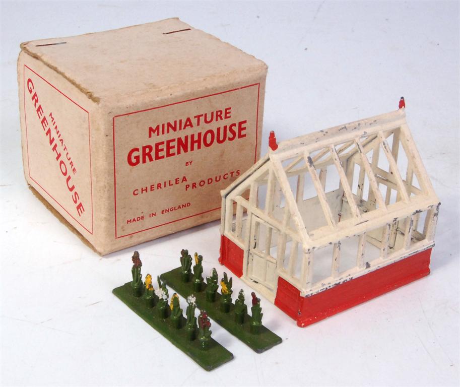 Cherilea lead miniature greenhouse, in orange and white, with 2 original lead plant pot groups,