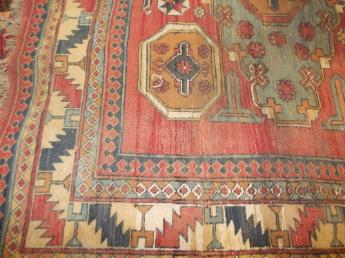 Soumak rug with large centre medallion and multiple borders on a beige ground