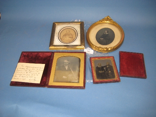 Two cased Daguerrotypes and two framed photographs of seated Victorian ladies