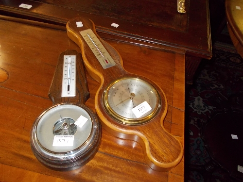 Two oak and mahogany cased wheel barometers