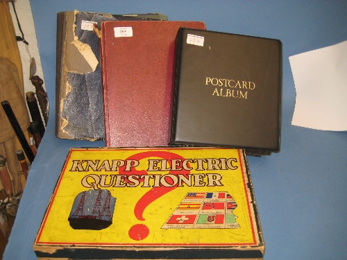 Three albums containing a collection of various postcards together with a Knapp Electric