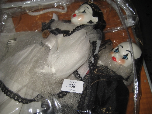 Pair of mid 20th Century porcelain dolls dressed as clowns