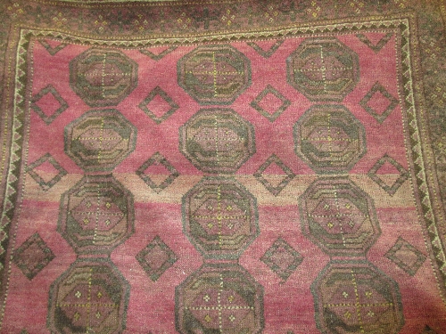 Afghan rug with twin panel design on pink ground