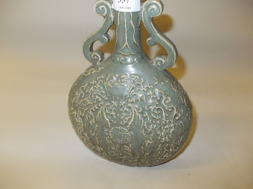 20th Century Chinese moonflask relief moulded with bats and flowers on a green ground, with