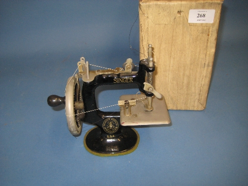 Miniature child`s Singer sewing machine