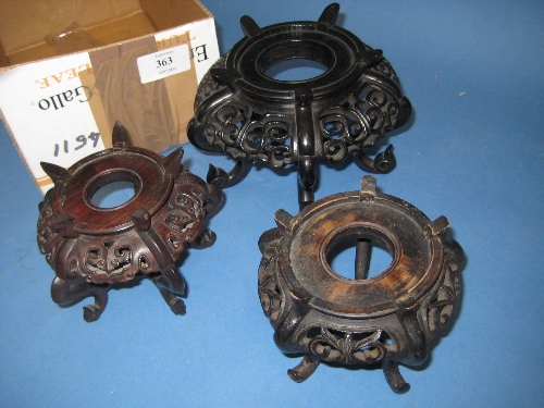 Group of three various Chinese carved hardwood vase stands of circular pierced design
