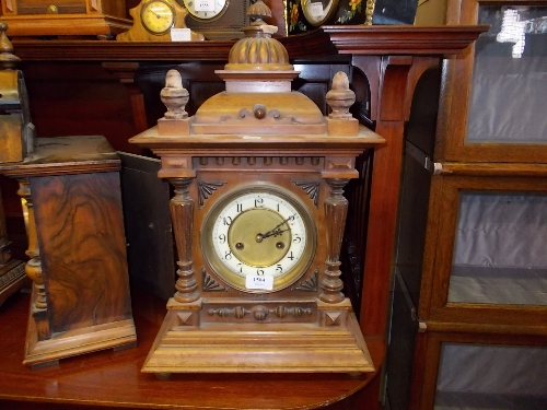 19th Century Continental walnut mantel clock with domed surmount, the two train movement striking on