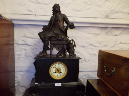 19th Century French black slate two train mantel clock surmounted by a patinated spelter figure of a