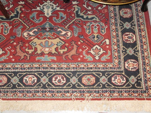 Small rug with red ground and geometric design together with a larger 20th Century Persian style