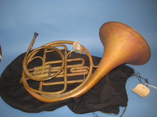 Small brass French horn with slip case