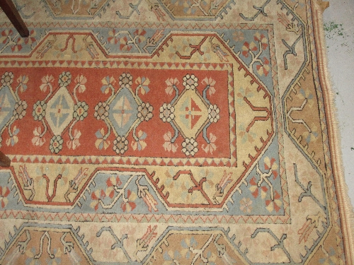 Rug having pale blue and cream ground with geometric design